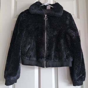 Black faux fur bomber jacket with silver O ring zipper and collar